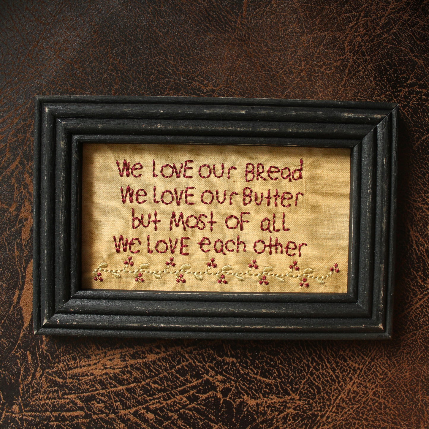 CVHOMEDECO. Primitives Antique We Love Our Bread, We Love Our Butter, But Most of All We Love Each Other Stitchery Frame Wall Mounted Hanging Decor Art, 9 x 6 Inch