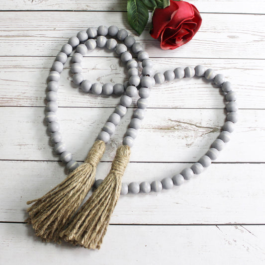 CVHOMEDECO. Wood Beads Garland with Tassels Farmhouse Rustic Wooden Prayer Bead String Wall Hanging Accent for Home Festival Decor. Grey Distressed