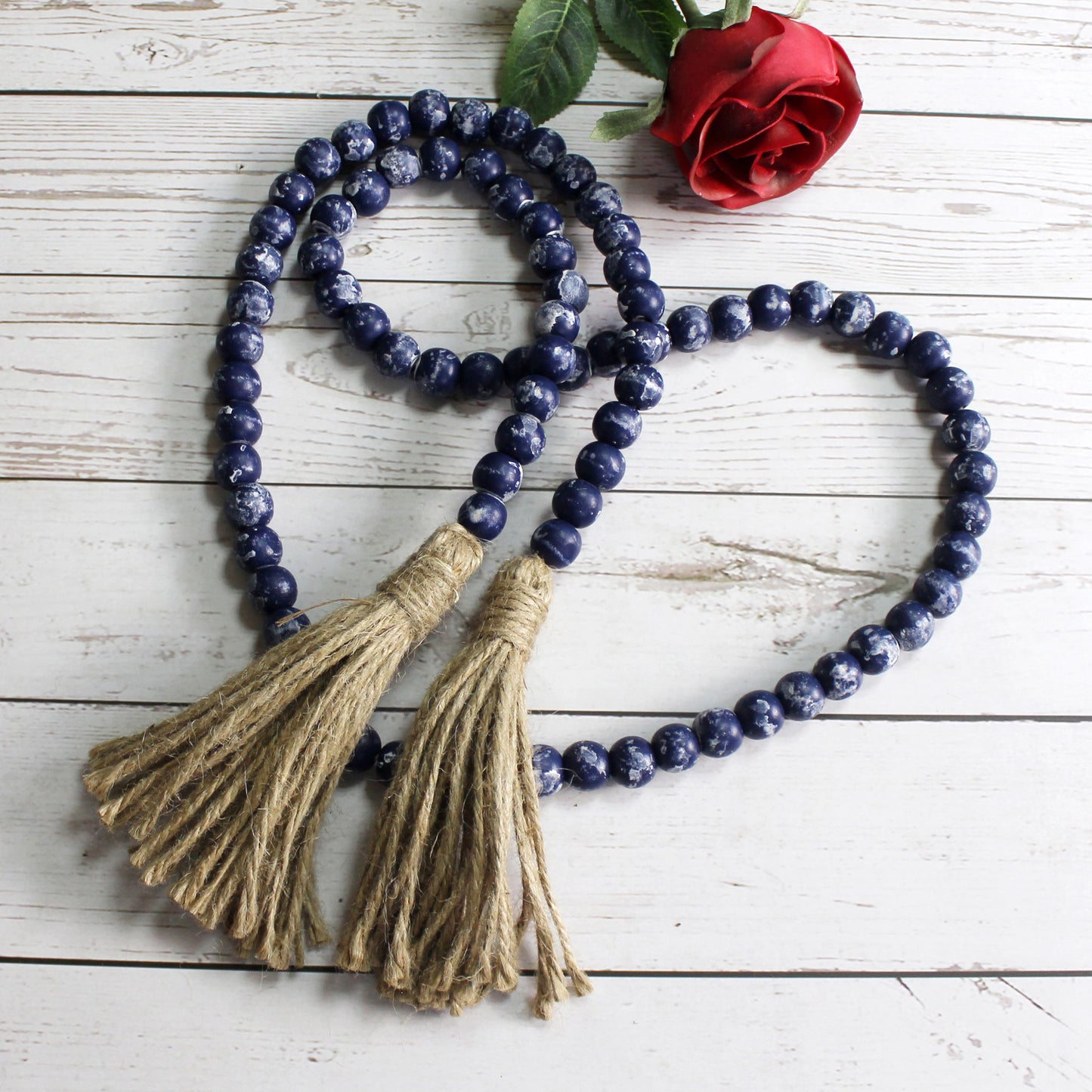 CVHOMEDECO. Wood Beads Garland with Tassels Farmhouse Rustic Wooden Prayer Bead String Wall Hanging Accent for Home Festival Decor. Navy Blue Distressed