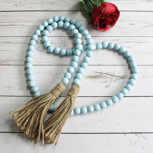 CVHOMEDECO. Wood Beads Garland with Tassels Farmhouse Rustic Wooden Prayer Bead String Wall Hanging Accent for Home Festival Decor. Teal Distressed