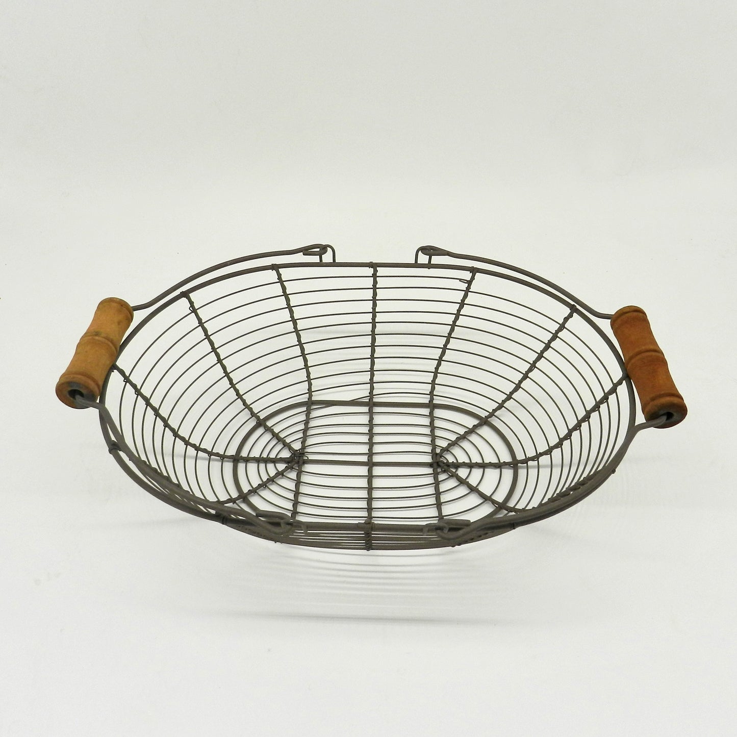 CVHOMEDECO. Oval Metal Wire Egg Basket Wire Basket with Wooden Handle Country Vintage Style Storage Basket. Rusty, 12.75 X 9 X 3.5 Inch