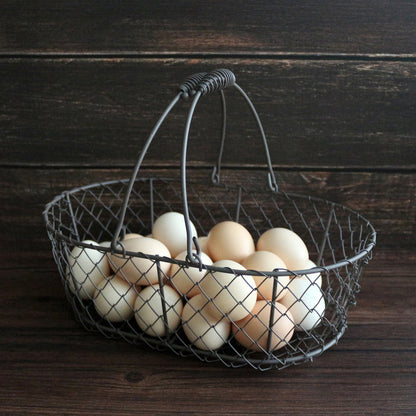 CVHOMEDECO. Oval Metal Wire Egg Basket Wire Fruit Basket with Handle Primitives Vintage Style Storage Basket. Rusty, 11 X 7.25 X 3.5 Inch